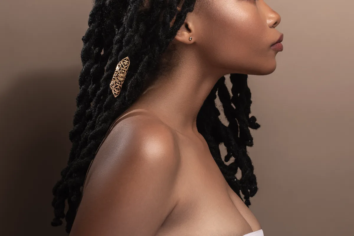 Profile portrait with faux locs