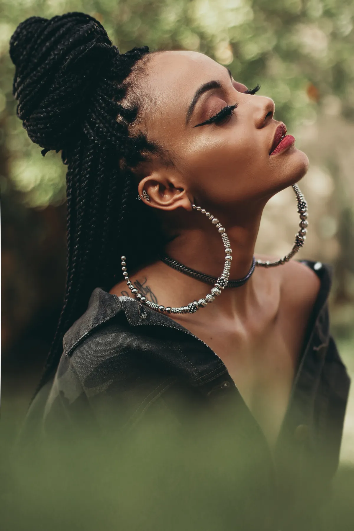 Braided updo with statement earrings