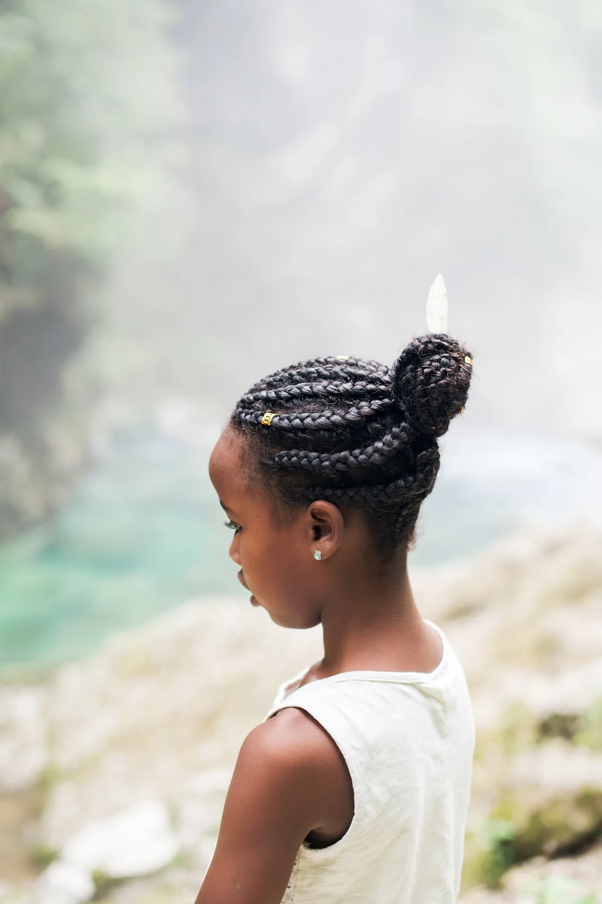 Child with a braided bun style